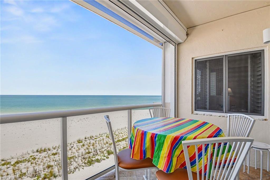 Image 3: DIRECT GULF VIEW FROM THE TILED LANAI.  REMOTE CONTROLLED PICTURE WINDOW NO-SEEUM SCREEN PLUS NEW ELECTRIC METAL SHUTTER.  IMPACT RESISTANT OWNER'S SUITE WINDOW SHOWN.  ENTRANCE TO LIVING AREA IS TO RIGHT.