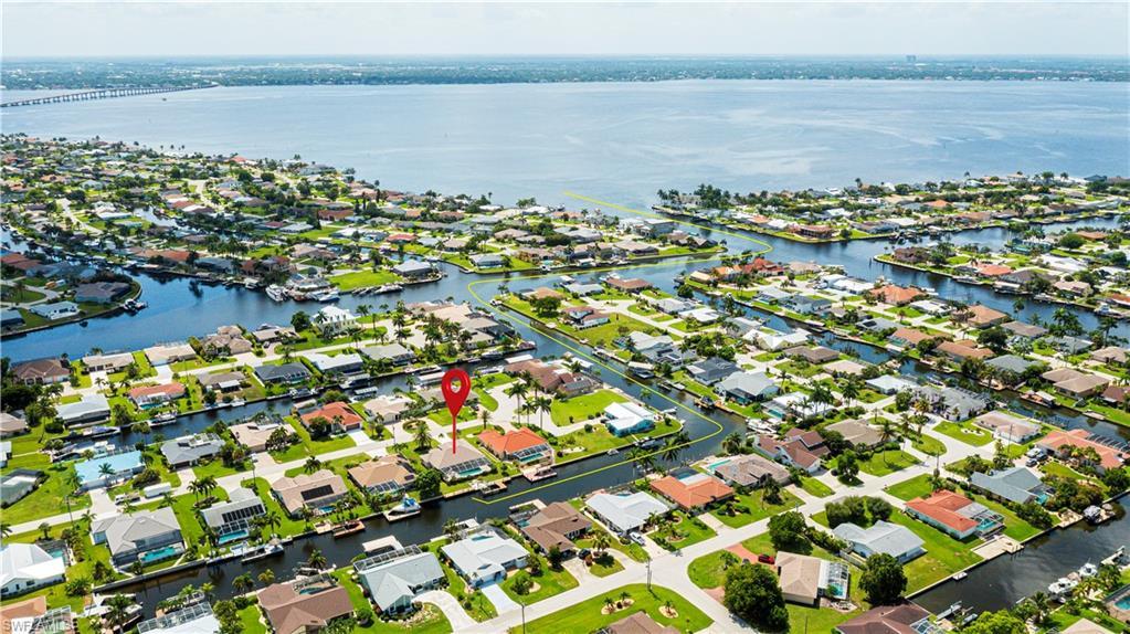 Image 3: Waterfront residential neighborhood featuring canals and direct access to a large body of water