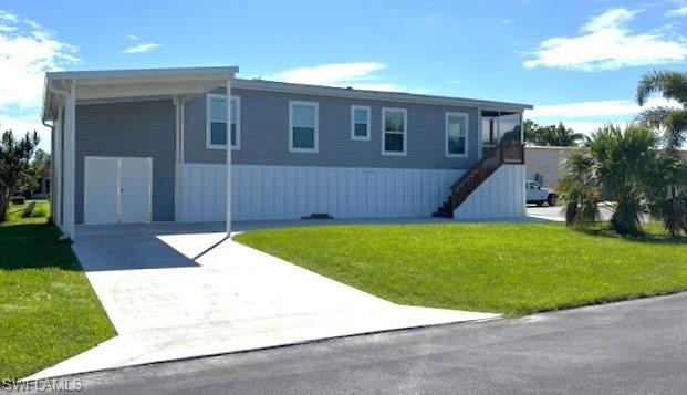 Image 2: SW side of home featuring double doors to attached shed