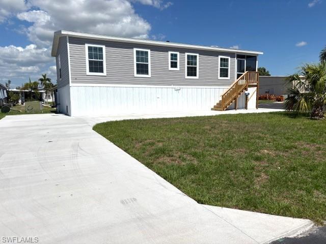 Image 4: SW side of home with large curved drive
