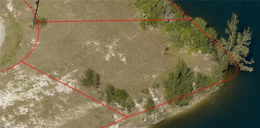 Image 2: Waterfront parcel featuring a cul-de-sac and mature trees