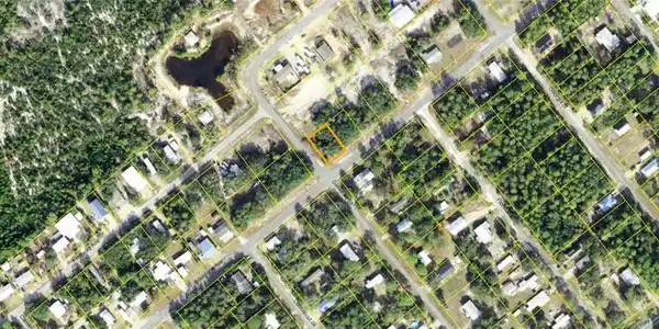 Image 2: Aerial Map. Displaying the property boundaries within a developed area