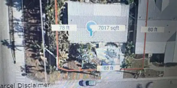 Image 2: Lot with home pre Ian