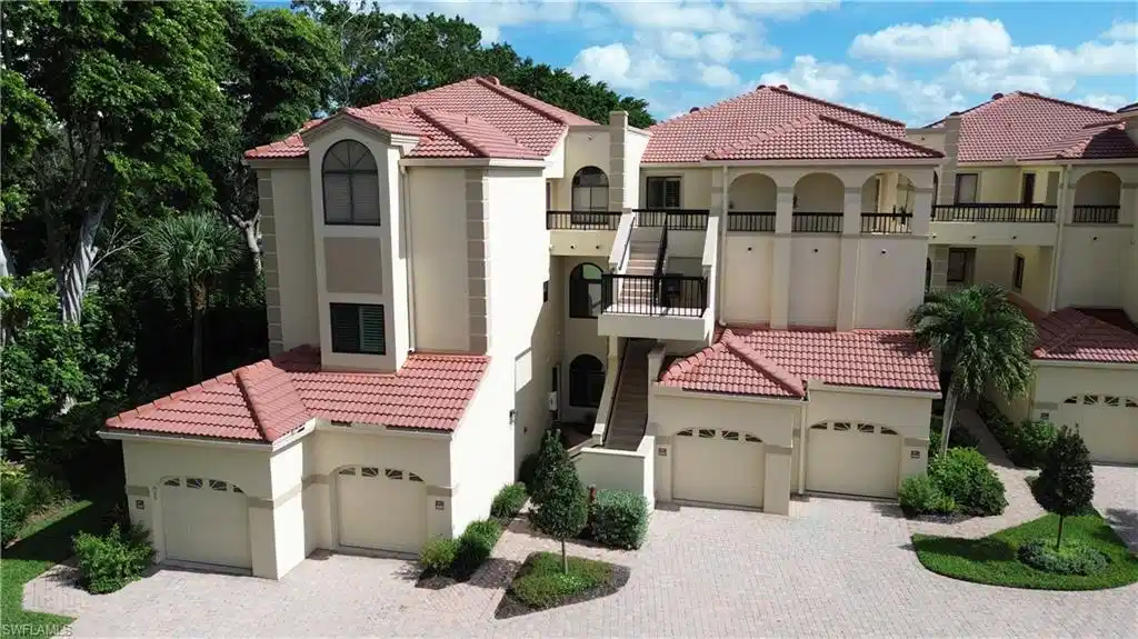 Image 1: Mediterranean / spanish-style home with stucco siding, a tile roof, a balcony, and a garage