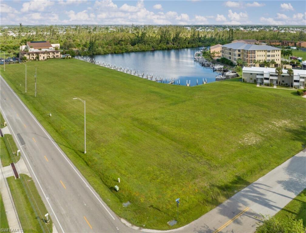 Image 3: Aerial view featuring level lot with water view and access
