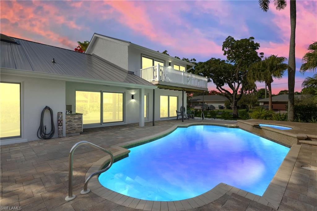 Image 3: Swimming pool featuring a patio area and an in-ground cool water spa