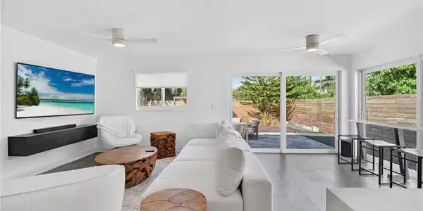 Image 4: Living room featuring ceiling fan and light tile patterned floors