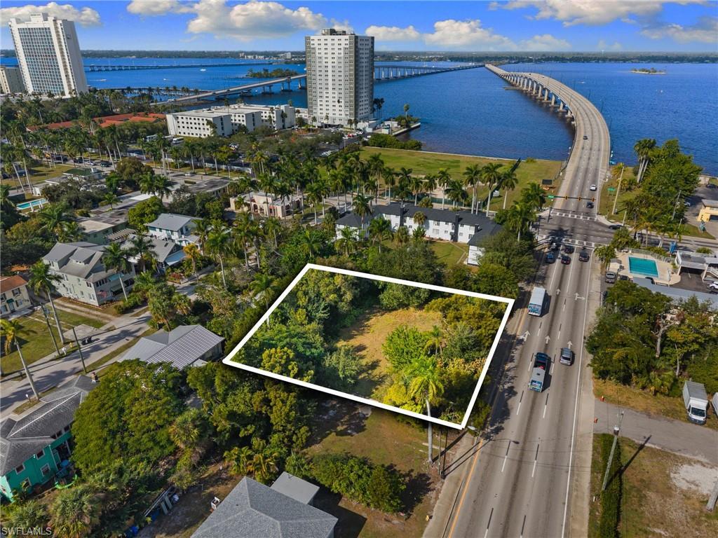 Image 2: Aerial view of property and surrounding area with a notable bridge, a large body of water, and property boundaries highlighted