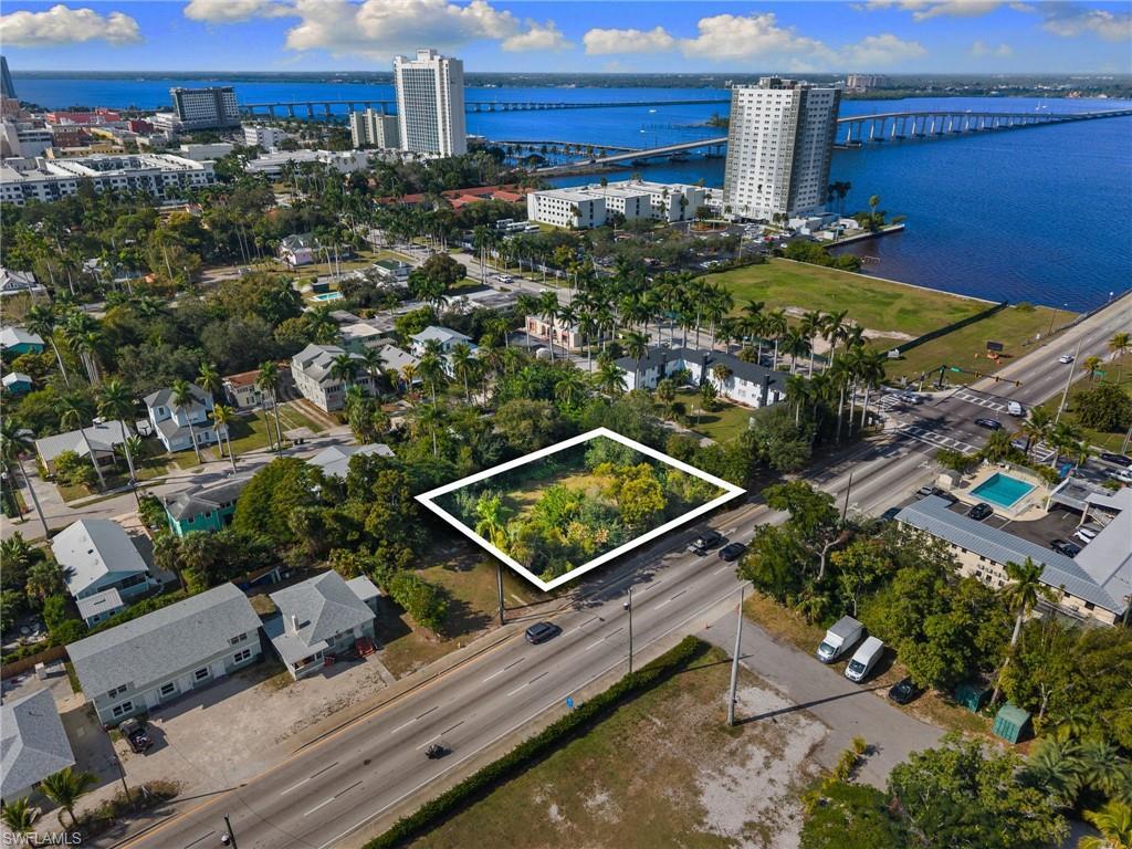 Image 4: View of urban area with a notable bridge, property boundaries highlighted, and a nearby body of water