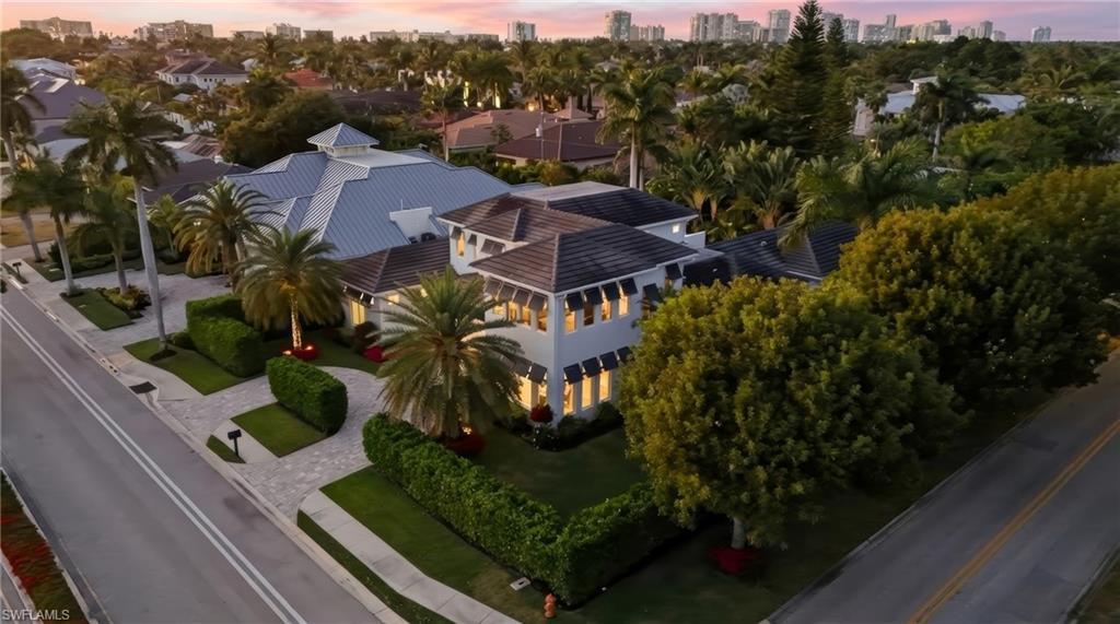 Image 4: Large corner lot with open green space.