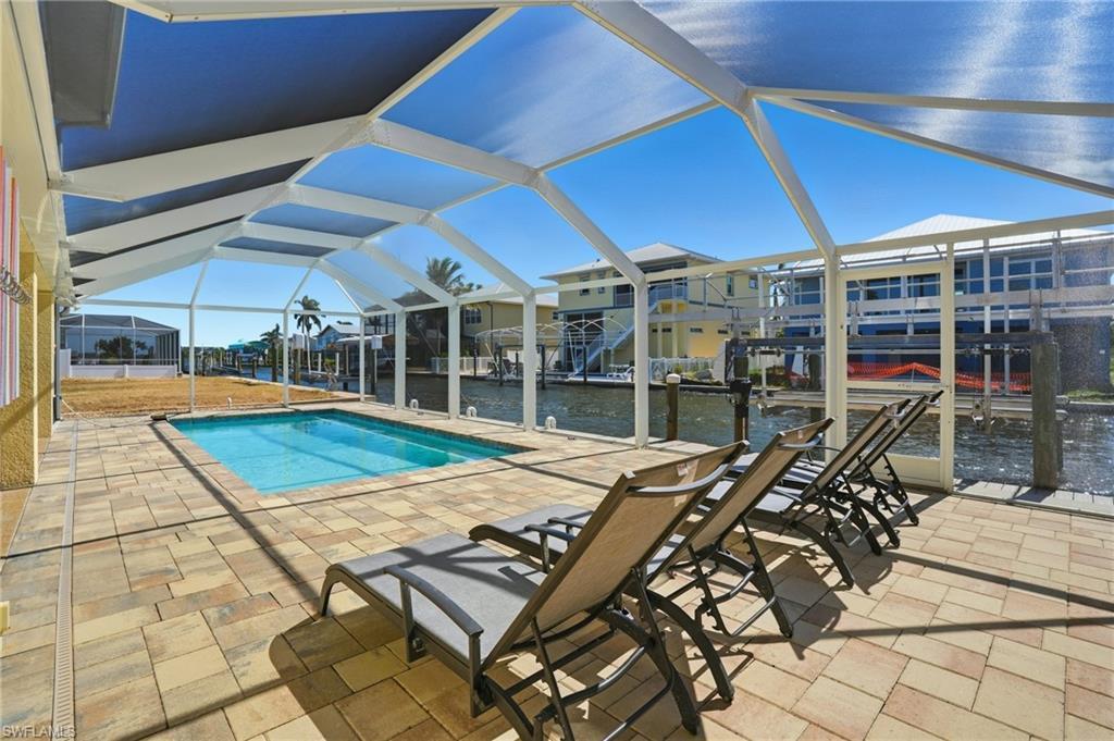 Image 2: Canal-front Gorgeous Sparkling Pool Home - Virtually Edited Image
