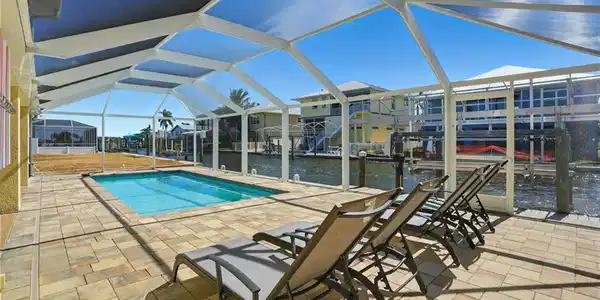 Image 2: Canal-front Gorgeous Sparkling Pool Home - Virtually Edited Image