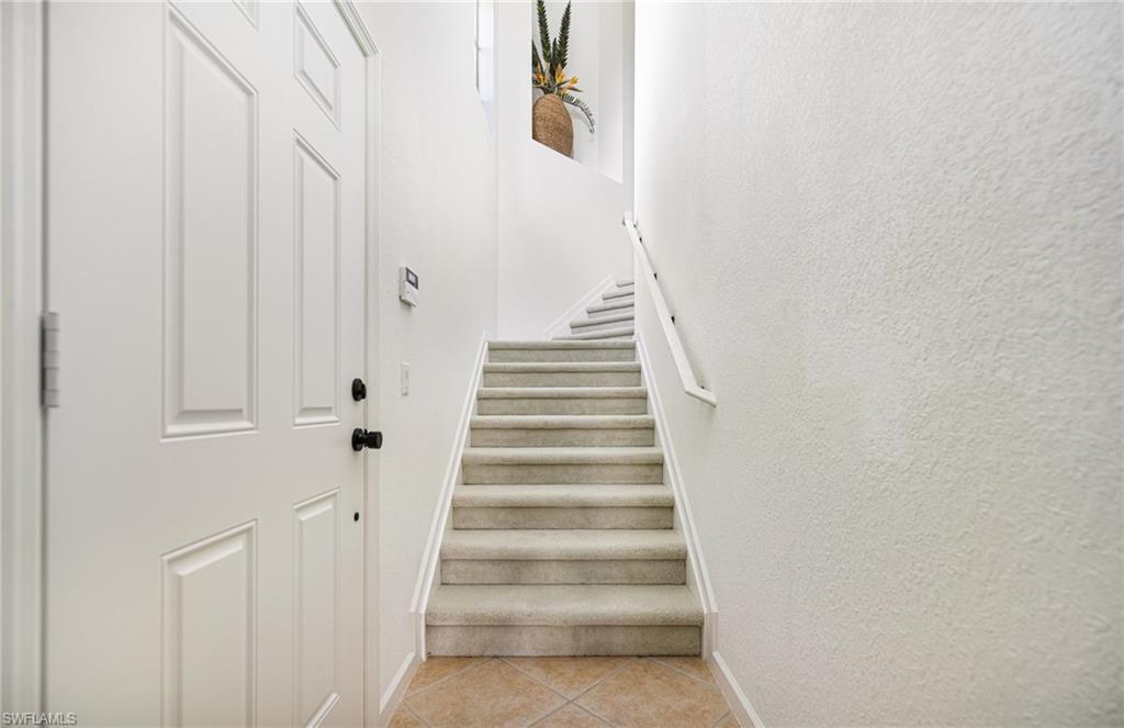 Image 2: Stairway with tile patterned floors