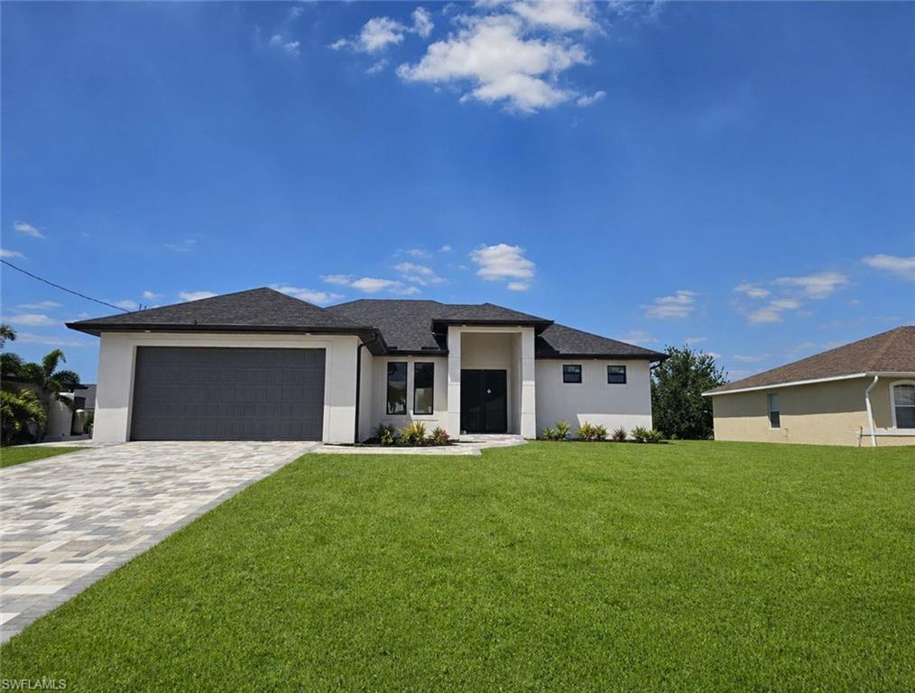 Image 1: Contemporary single-story residence featuring a dark shingle roof, white stucco exterior, and a two-car garage with a dark gray door