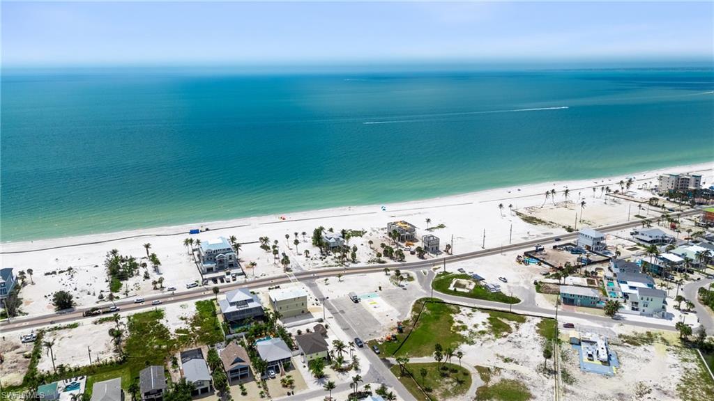 Image 3: Aerial view with a water view and a view of the beach  - Virtually Edited Image
