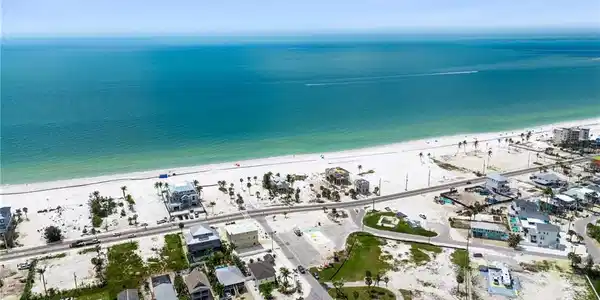 Image 3: Aerial view with a water view and a view of the beach  - Virtually Edited Image