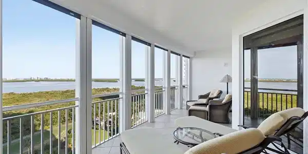 Image 3: Expansive screened lanai overlooking the Gulf and bay.