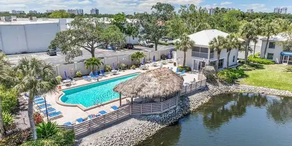 Image 3: Aerial view of community pool and clubhouse.