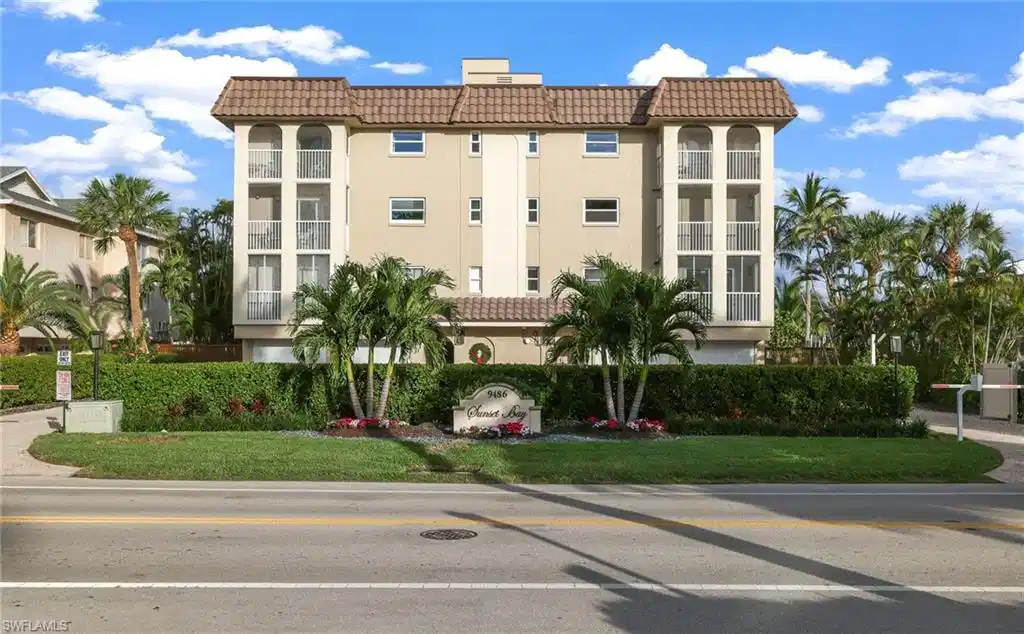 Image 1: Multi-story building featuring a tiled roof and multiple screened balconies
