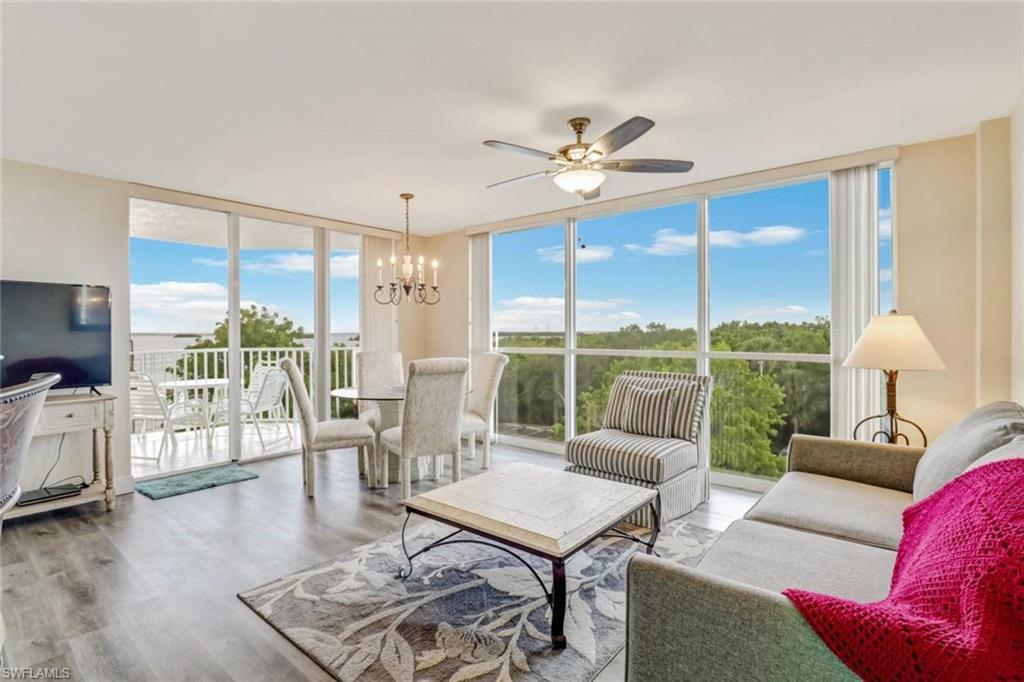 Image 4: Sunroom featuring a chandelier
