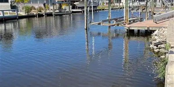 Image 2: Dock with boat lift and a water view