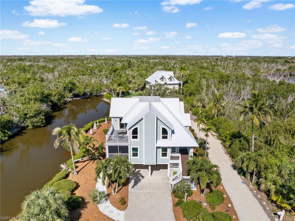 Image 3: Welcome to 241 Violet Drive, a beautifully reimagined coastal retreat on Sanibel Island.