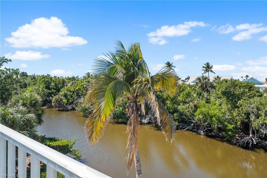 Image 4: Peaceful lake views set the tone for relaxed Sanibel living.