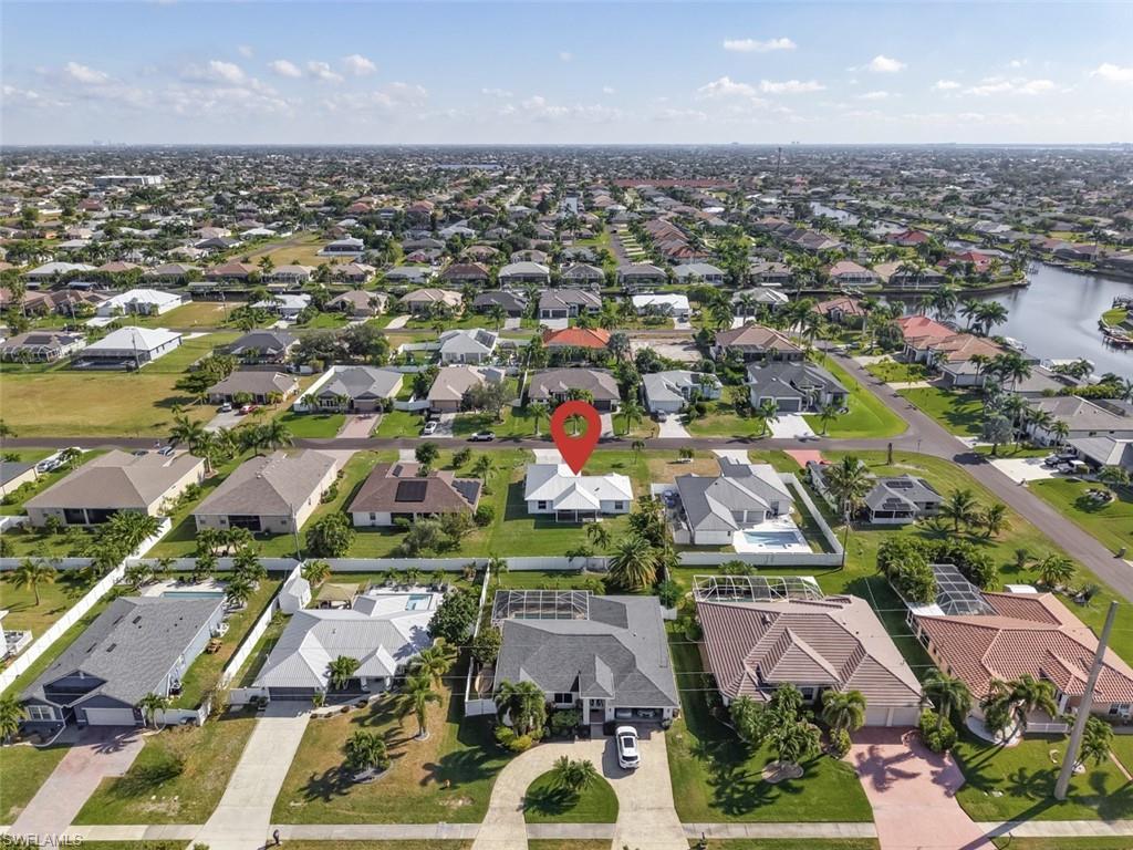 Image 2: Aerial overview of property's location featuring nearby suburban area