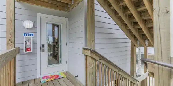 Image 3: Doorway to property with a deck