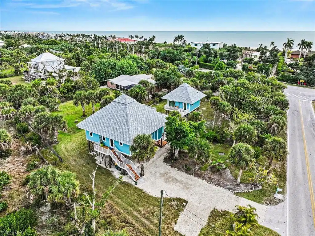 Image 1: Amazing location right across from the beach on .72 acres!
