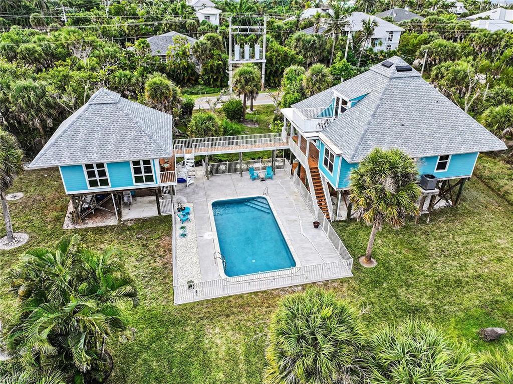 Image 2: Amazing location right across from the beach on .72 acres!