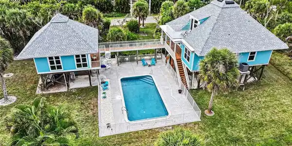 Image 2: Amazing location right across from the beach on .72 acres!