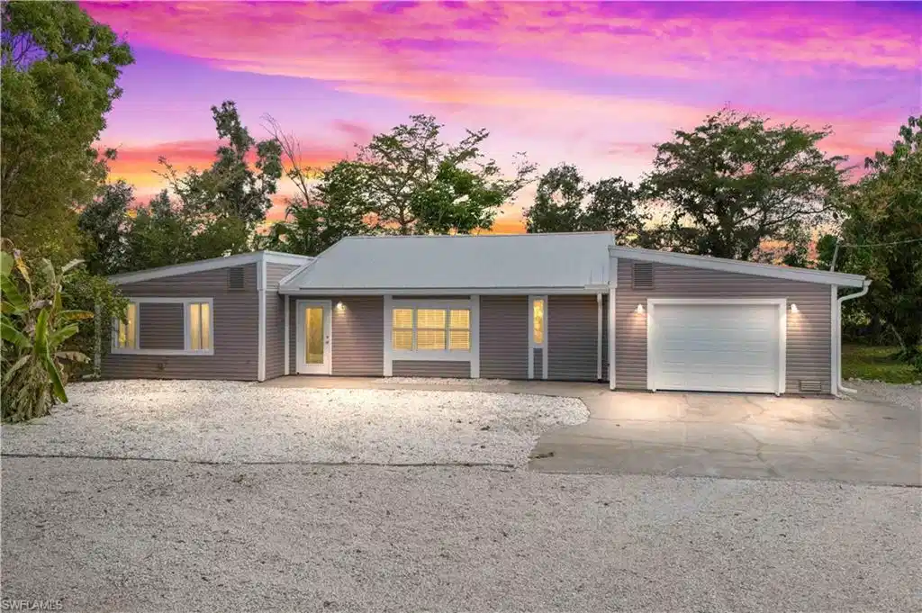 Image 1: Welcome home to your private Pine Island retreat&mdash;nestled on over an acre of lush, peaceful land with a gated front yard and serene island surroundings.