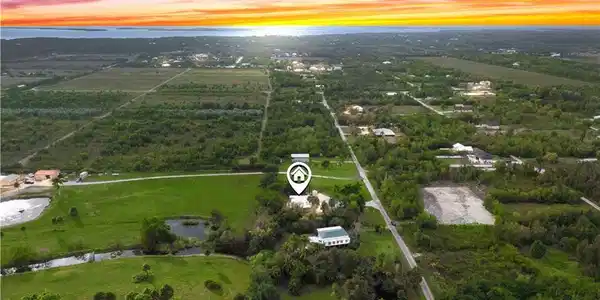Image 2: Sunset skies highlight the privacy and beauty of this secluded Pine Island property.