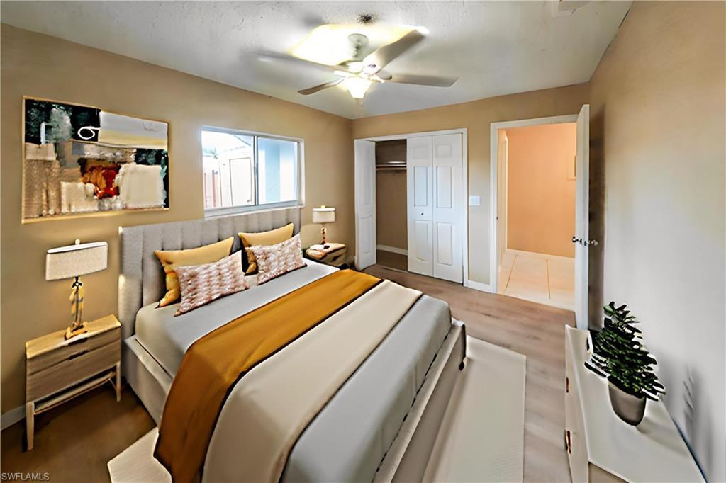 Image 4: Bedroom with ceiling fan, a closet, and light wood finished floors