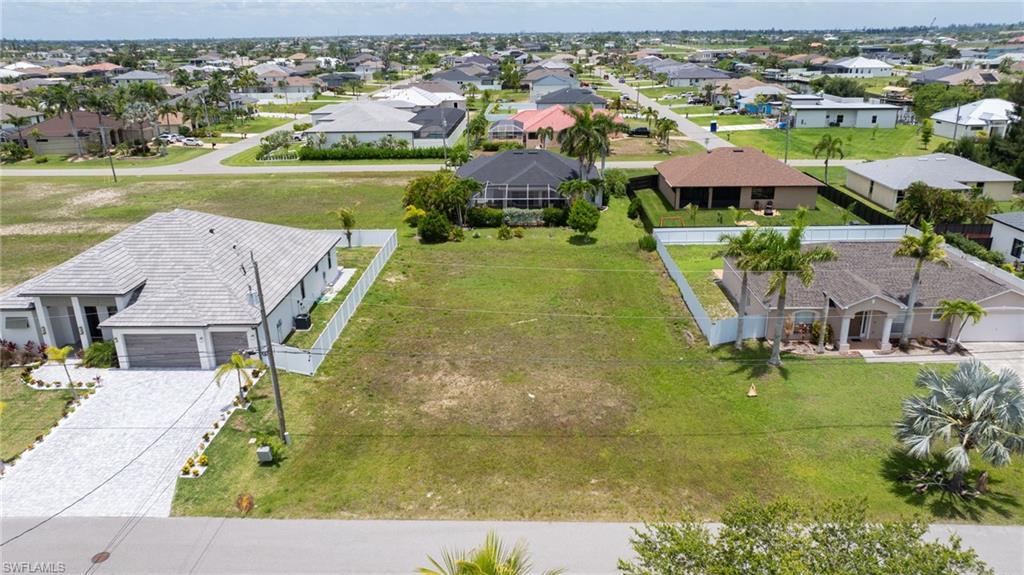 Image 1: Aerial perspective of suburban area