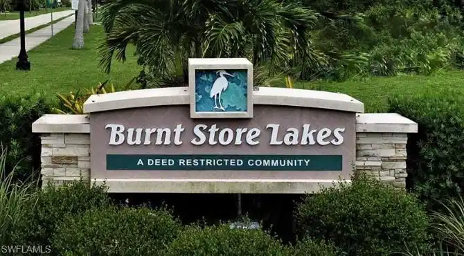 Image 1: Community / neighborhood sign featuring a yard