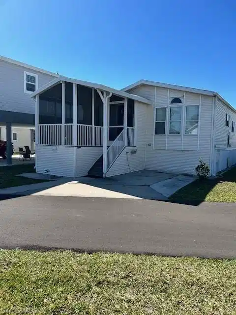 Image 1: Manufactured / mobile home featuring a patio and a sunroom