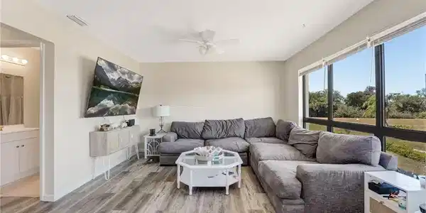 Image 2: The living area is bright, welcoming, and perfectly positioned to enjoy the waterfront setting.