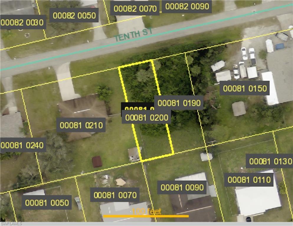 Image 2: Aerial view of property's location featuring property parcel outlined