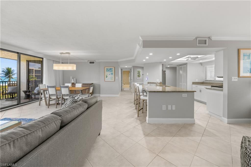 Image 3: Open living/dining room.