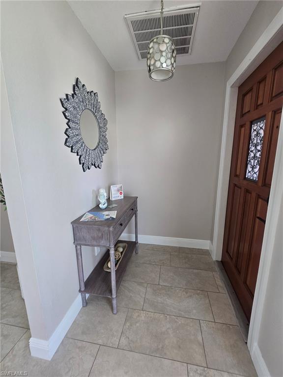 Image 2: Foyer with custom door & lighting