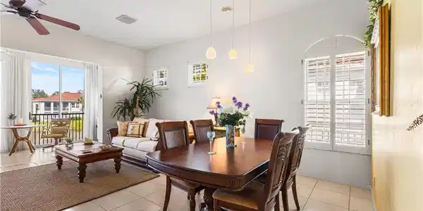Image 4: Dining in the great room with lake views.
