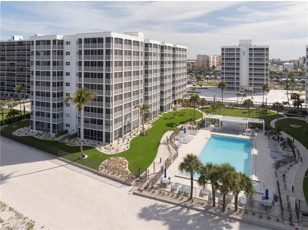 Image 4: View of apartment building / complex with a community pool