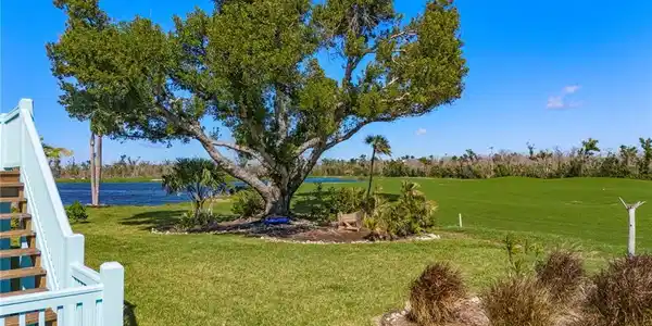 Image 3: View of green lawn with a water view and golf course view