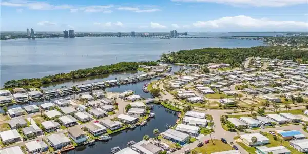 Image 3: Aerial perspective showcasing a residential community with direct water access