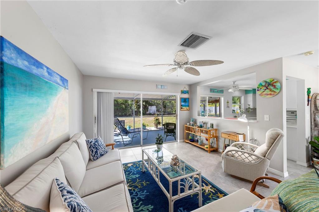 Image 1: beautiful great room opens to the kitchen area to entertain