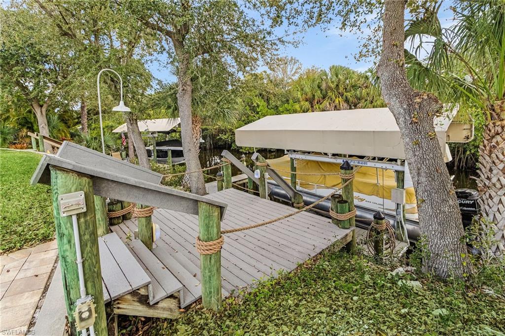 Image 2: Waterfront dock featuring durable composite decking and integrated rope railings