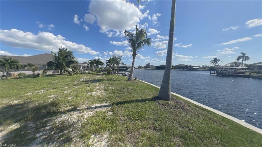 Image 3: Left side from middle of seawall on OVERSIZE SOUTHERN rear Exposure Gulf Access lot with NEW (12/2021) 121' SEAWALL - BIG WATER VIEWS