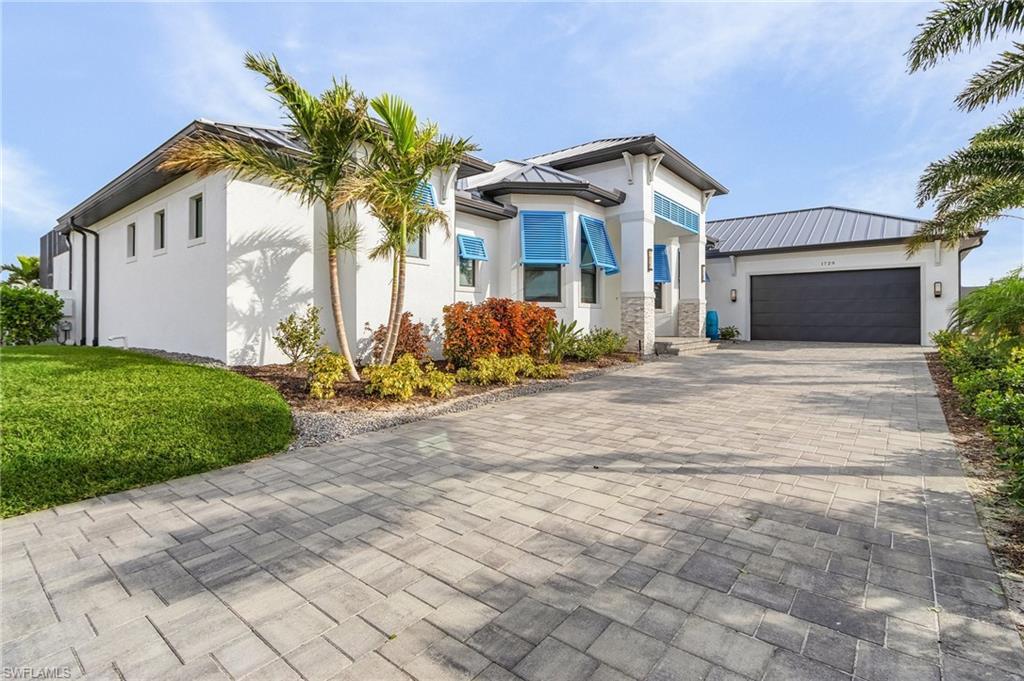 Image 2: View of front of property featuring a garage